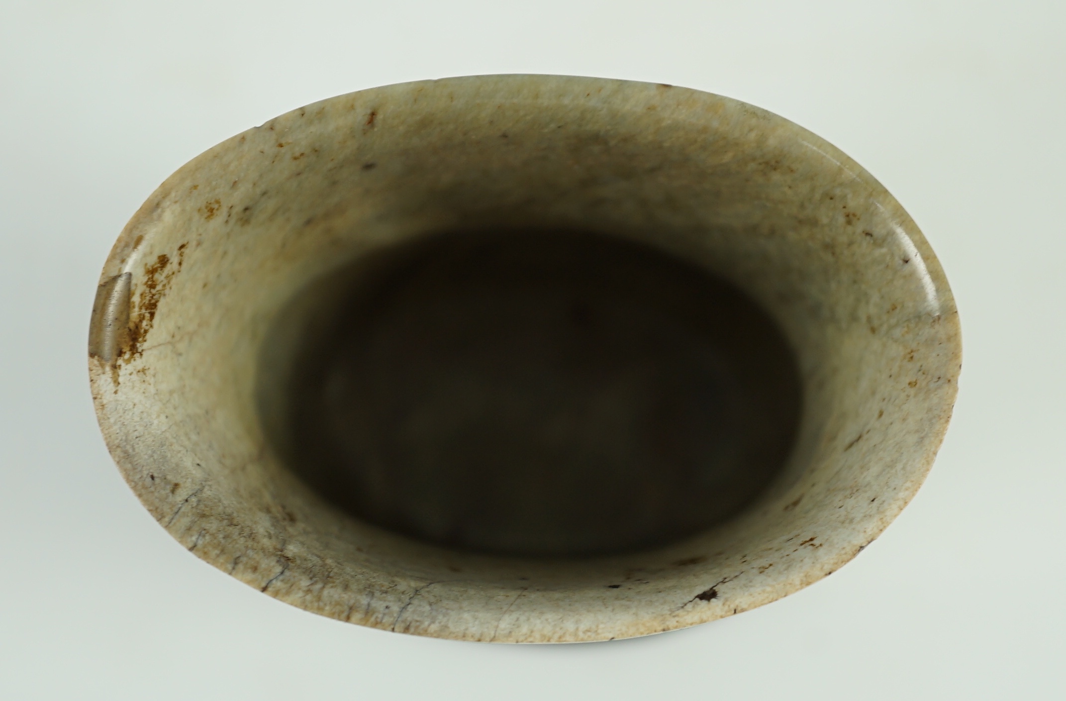 A Chinese archaistic burnt ‘chicken bone’ jade oval cup, chan, probably Song dynasty, 7.1 cm high, small chip repair